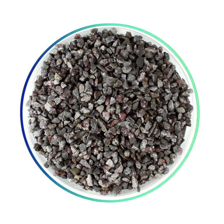 Hnědý korund (elektrokorund) – abrazivo v kulatém rámečku.